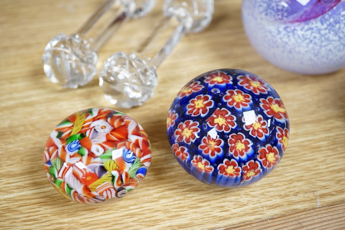 A collection of glass paperweights to include Caithness and millefiori examples, largest 10cm high